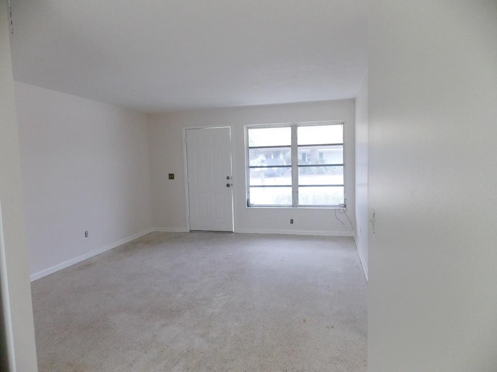 100 Southwest Hideaway Place Stuart, FL 34994 - Photo 6 of 23 an empty room with a window