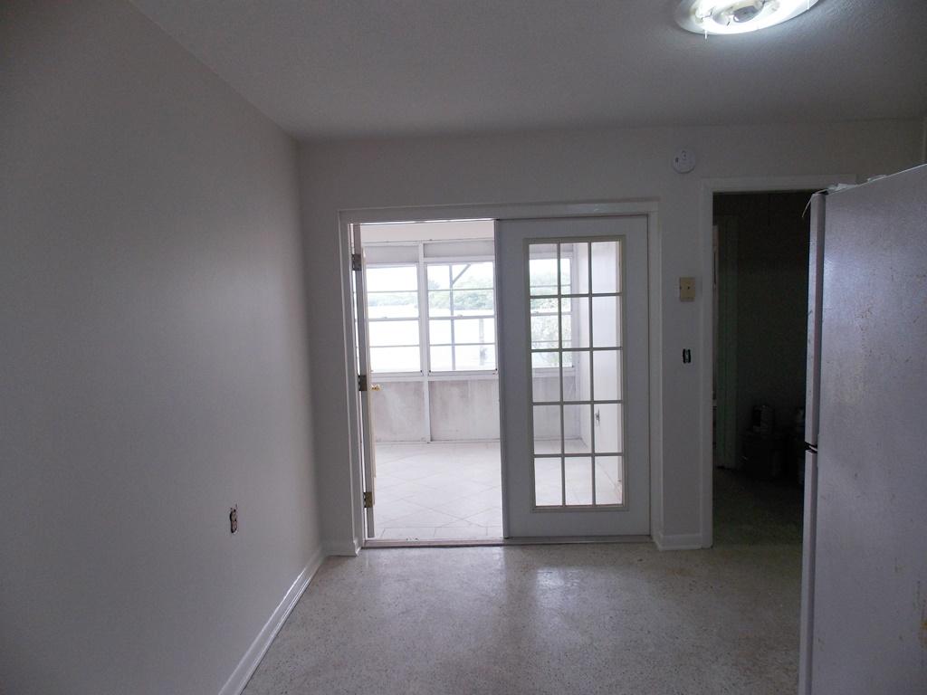 100 Southwest Hideaway Place Stuart, FL 34994 - Photo 7 of 23 an empty room with windows