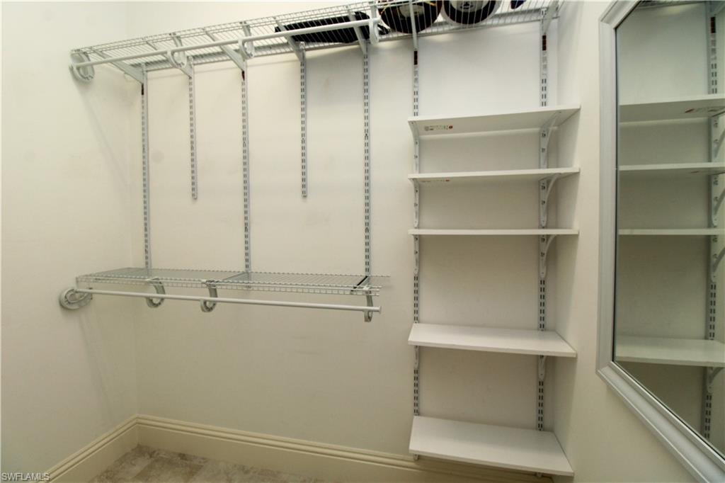 6184 Whitaker Road Naples, FL 34112 - Photo 26 of 50 a view of a room with rack on the wall