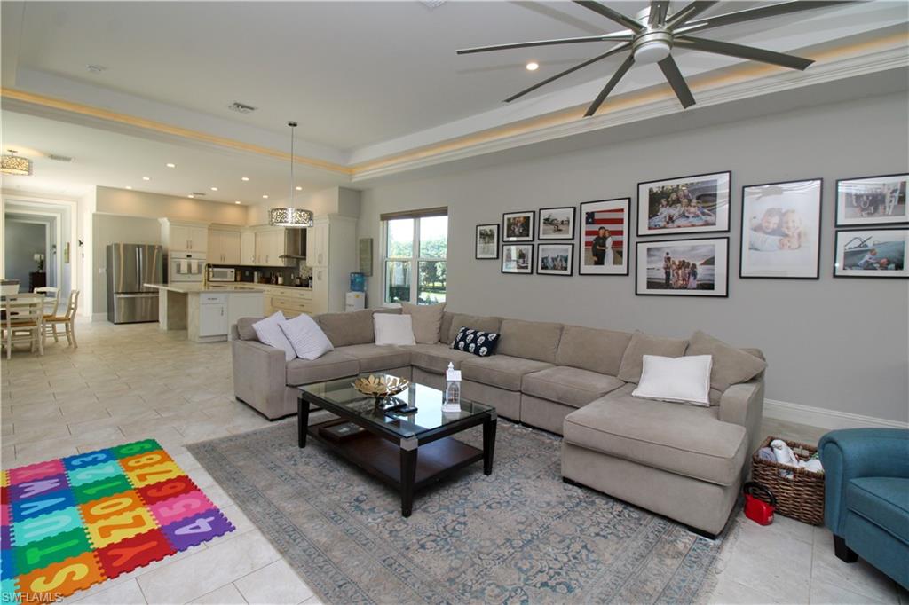 6184 Whitaker Road Naples, FL 34112 - Photo 30 of 50 a living room with furniture and view of kitchen