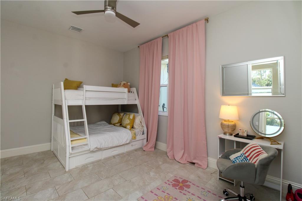 6184 Whitaker Road Naples, FL 34112 - Photo 39 of 50 a view of a workspace with furniture and a window