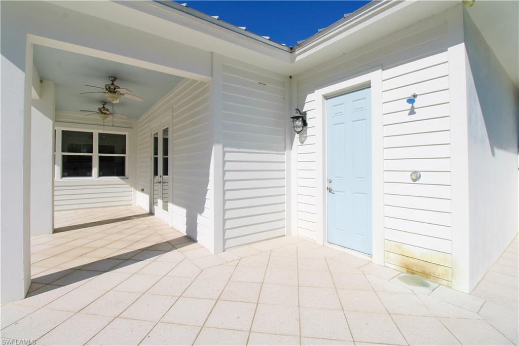 6184 Whitaker Road Naples, FL 34112 - Photo 4 of 50 a view of a house with a balcony