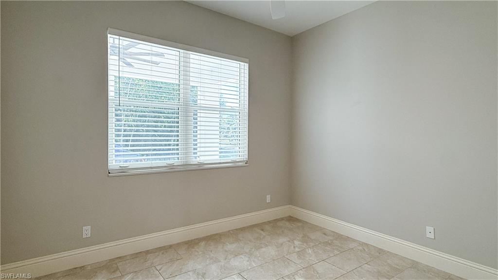 6184 Whitaker Road Naples, FL 34112 - Photo 47 of 50 a view of an empty room with a window