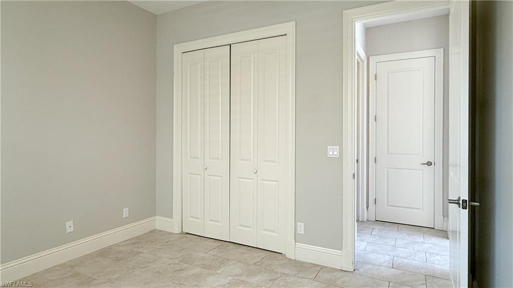6184 Whitaker Road Naples, FL 34112 - Photo 48 of 50 an empty room with closet area