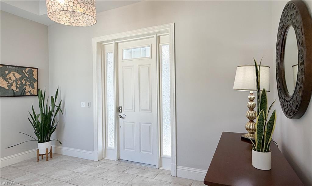 6184 Whitaker Road Naples, FL 34112 - Photo 49 of 50 a view of a potted plants in a hallway