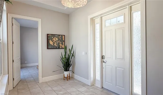 an entryway with a bookshelf