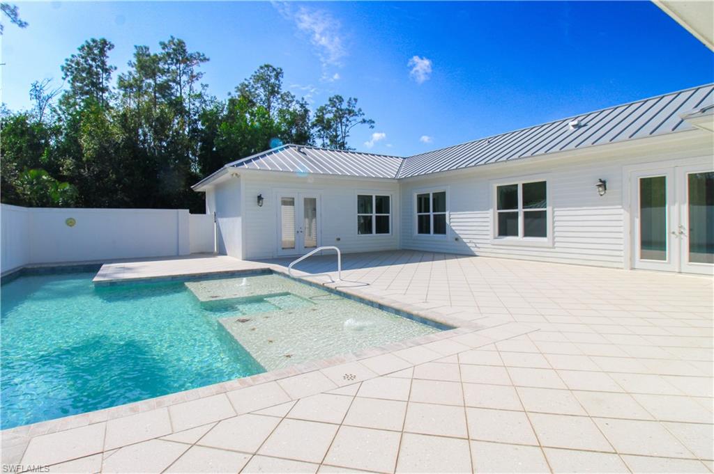 6184 Whitaker Road Naples, FL 34112 - Photo 6 of 50 a view of a house with a backyard
