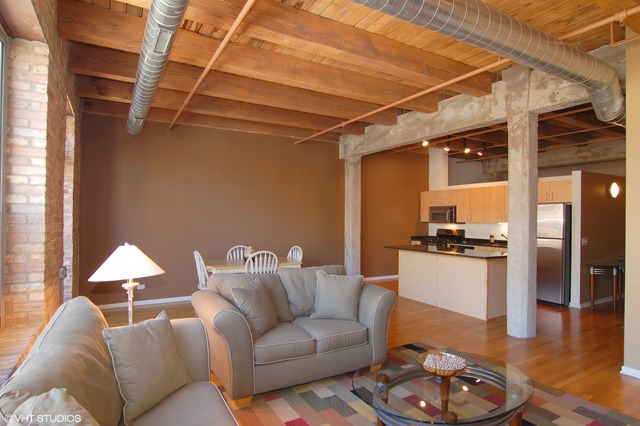 333 South Desplaines Street, Unit 605 Chicago, IL 60661 - Photo 3 of 8 a living room with furniture and a wooden floor