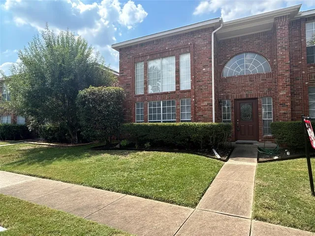 a view of a house with a garden