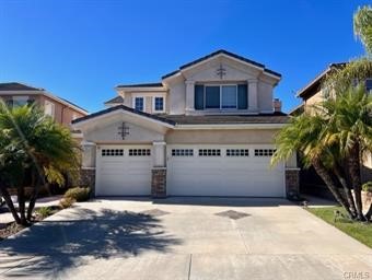 27465 Fieldpath Way Laguna Niguel, CA 92677 - Photo 1 of 25 a front view of a house with a yard and garage