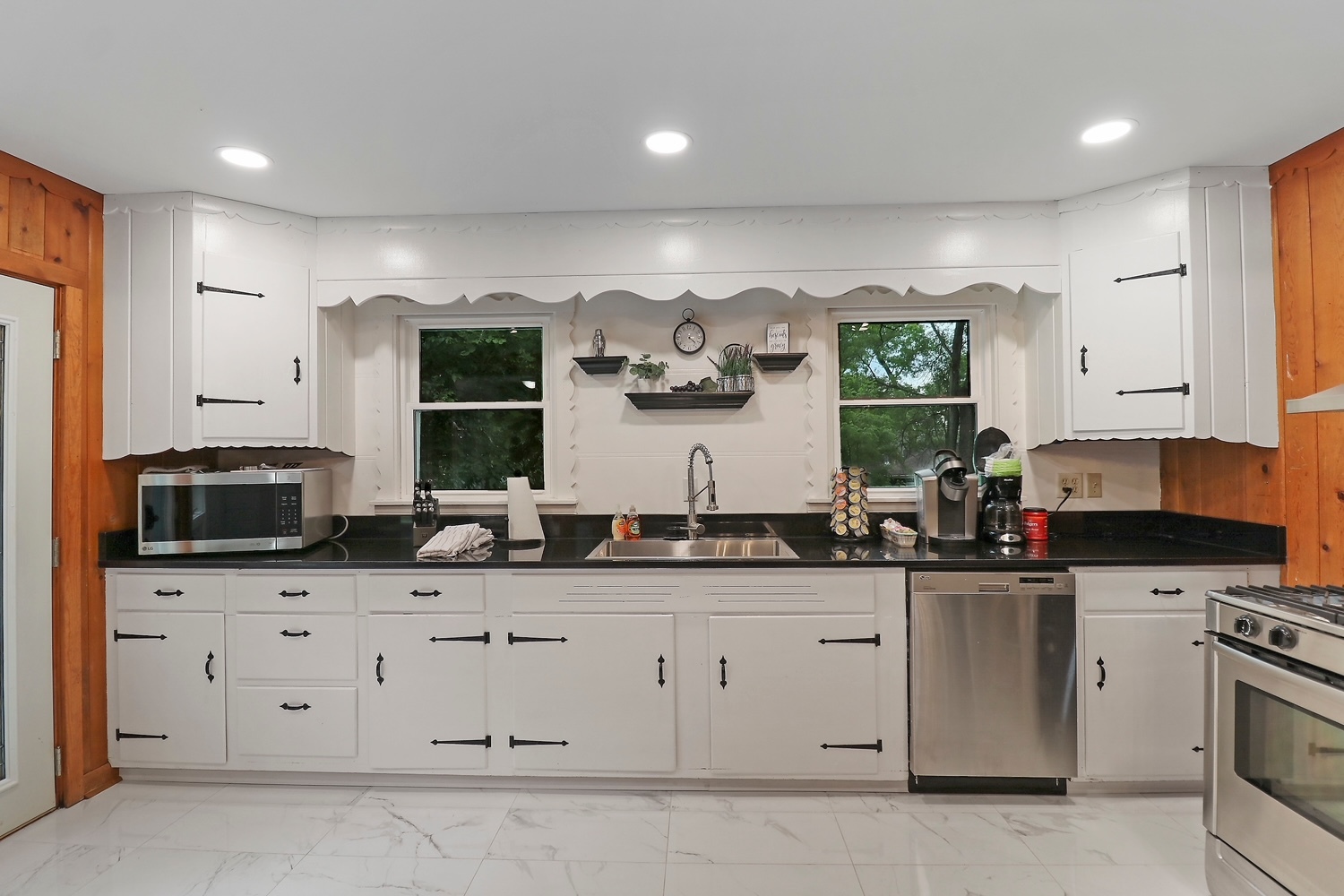 2618 Apache Trail McHenry, IL 60051 - Photo 13 of 34 a kitchen with granite countertop a sink a stove and cabinets