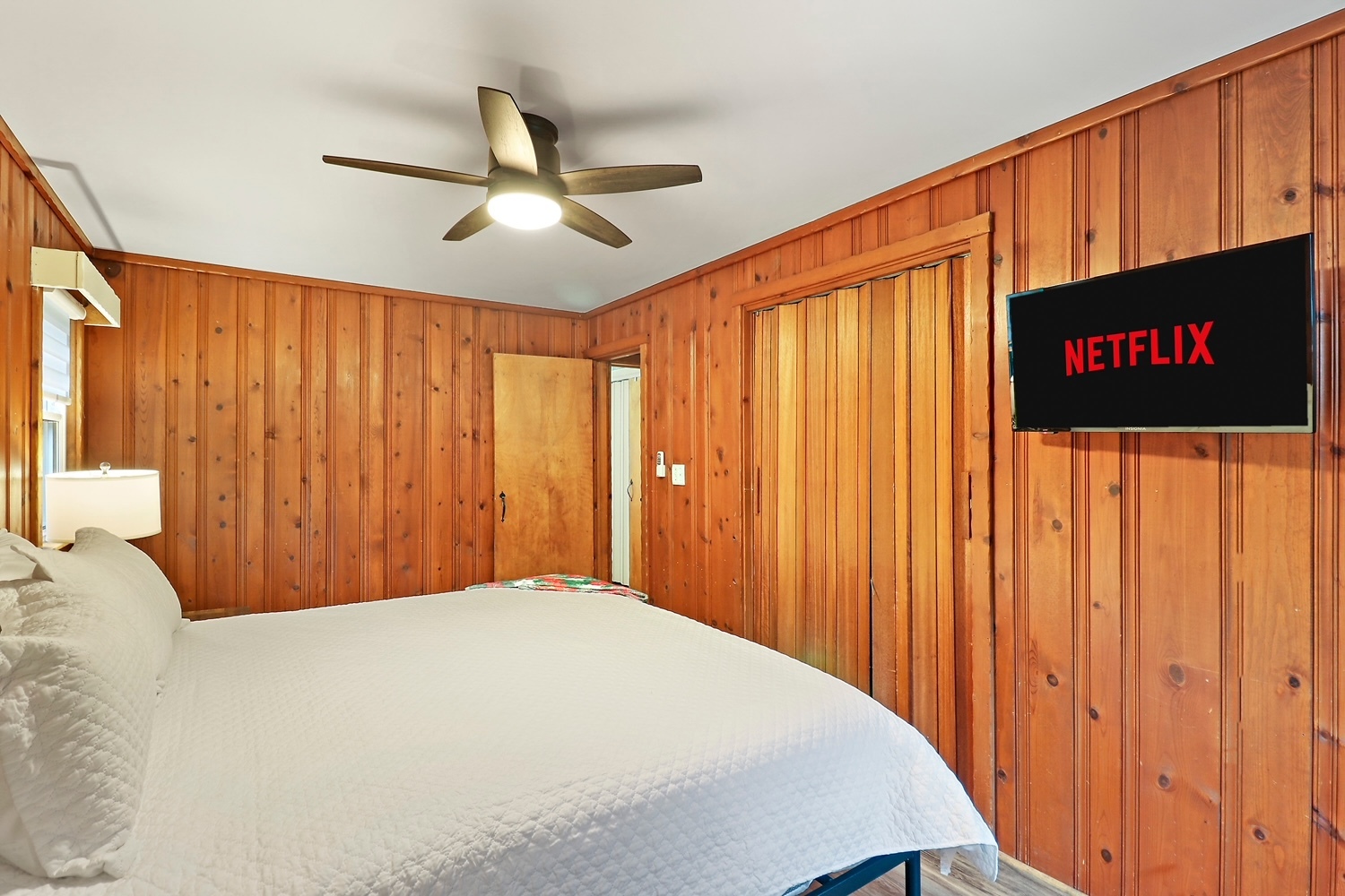 2618 Apache Trail McHenry, IL 60051 - Photo 20 of 34 a bedroom with a large bed and a chandelier