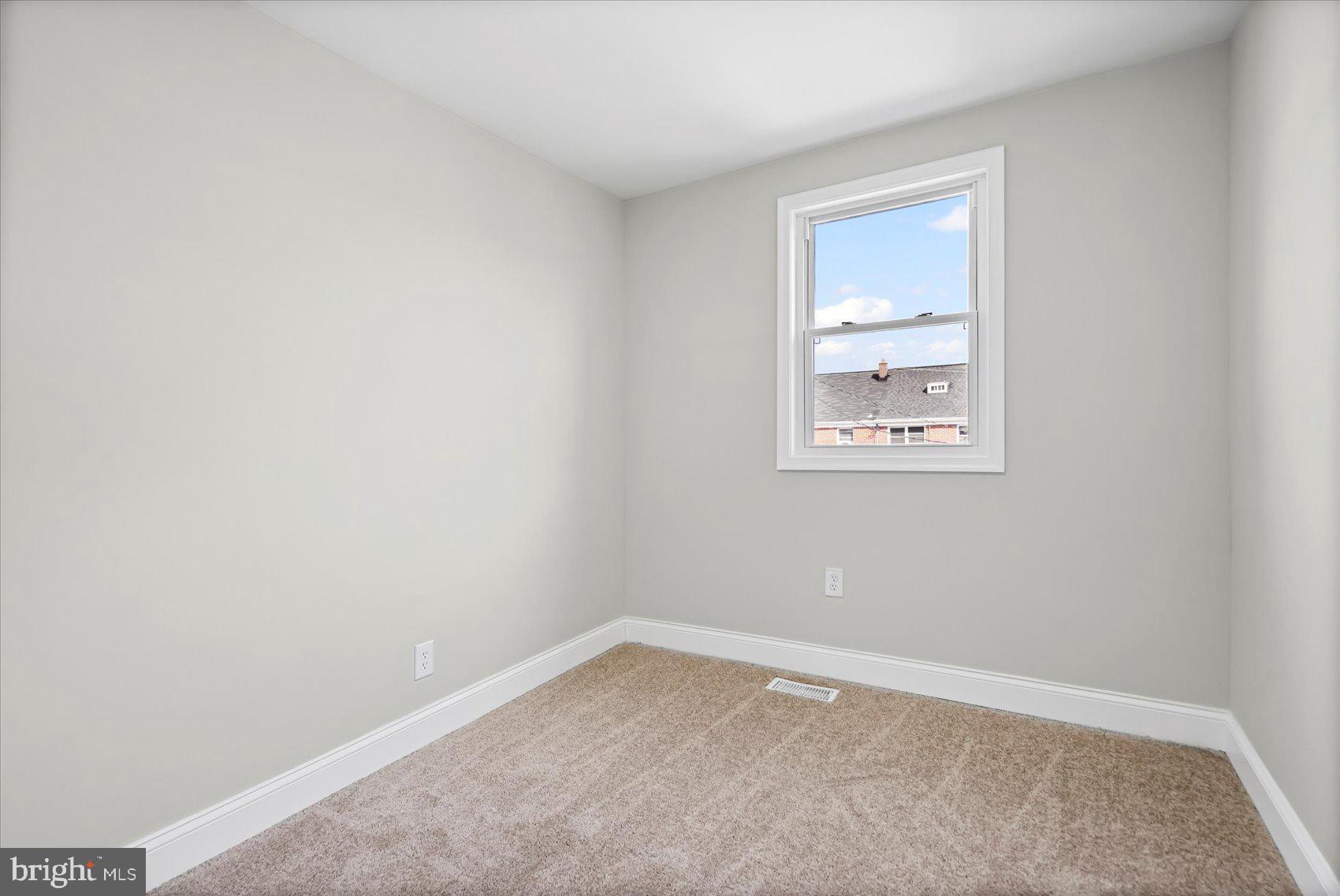 1812 Ingram Road Baltimore, MD 21239 - Photo 19 of 45 an empty room with a window