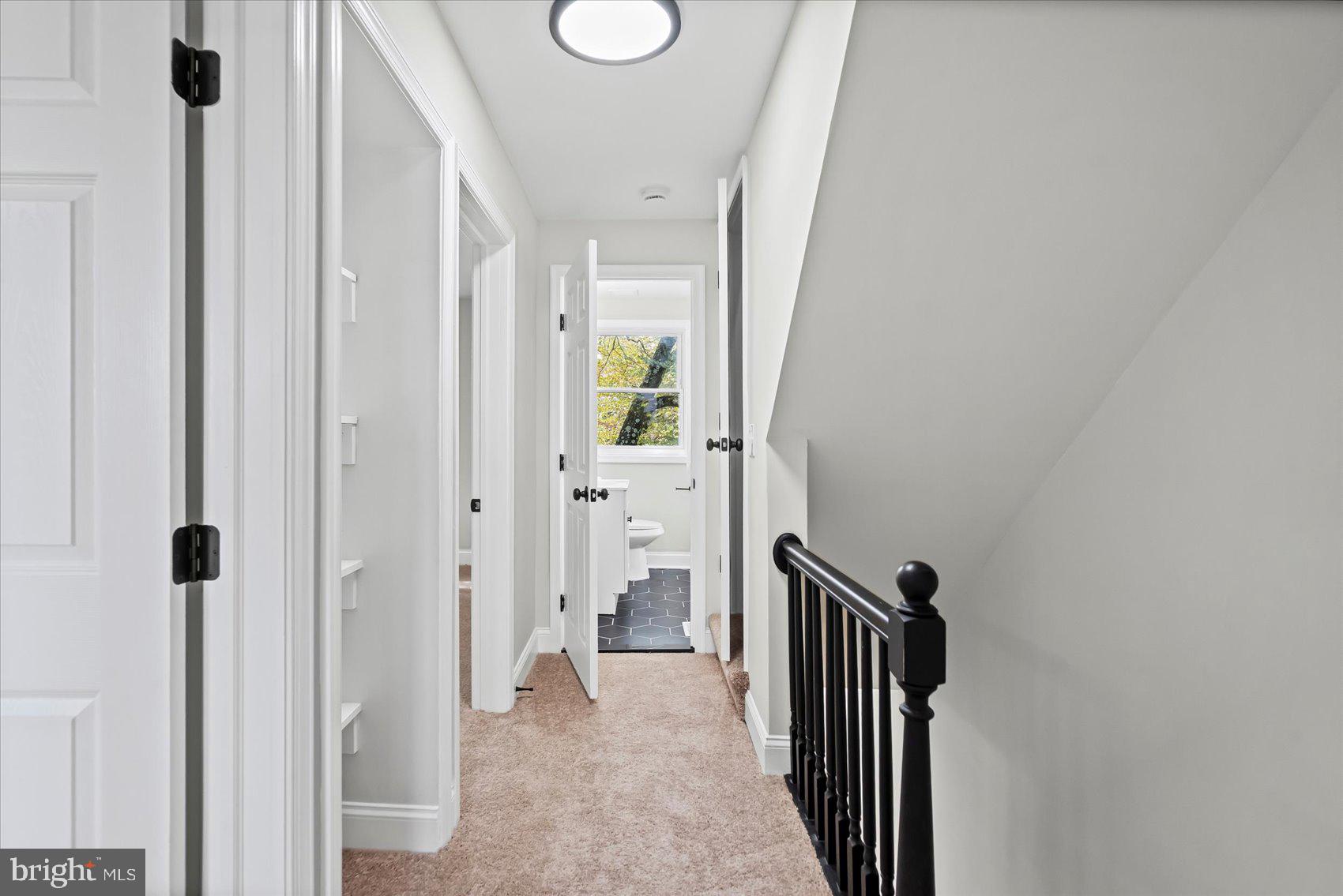 1812 Ingram Road Baltimore, MD 21239 - Photo 21 of 45 a view of a hallway with wooden floor and staircase