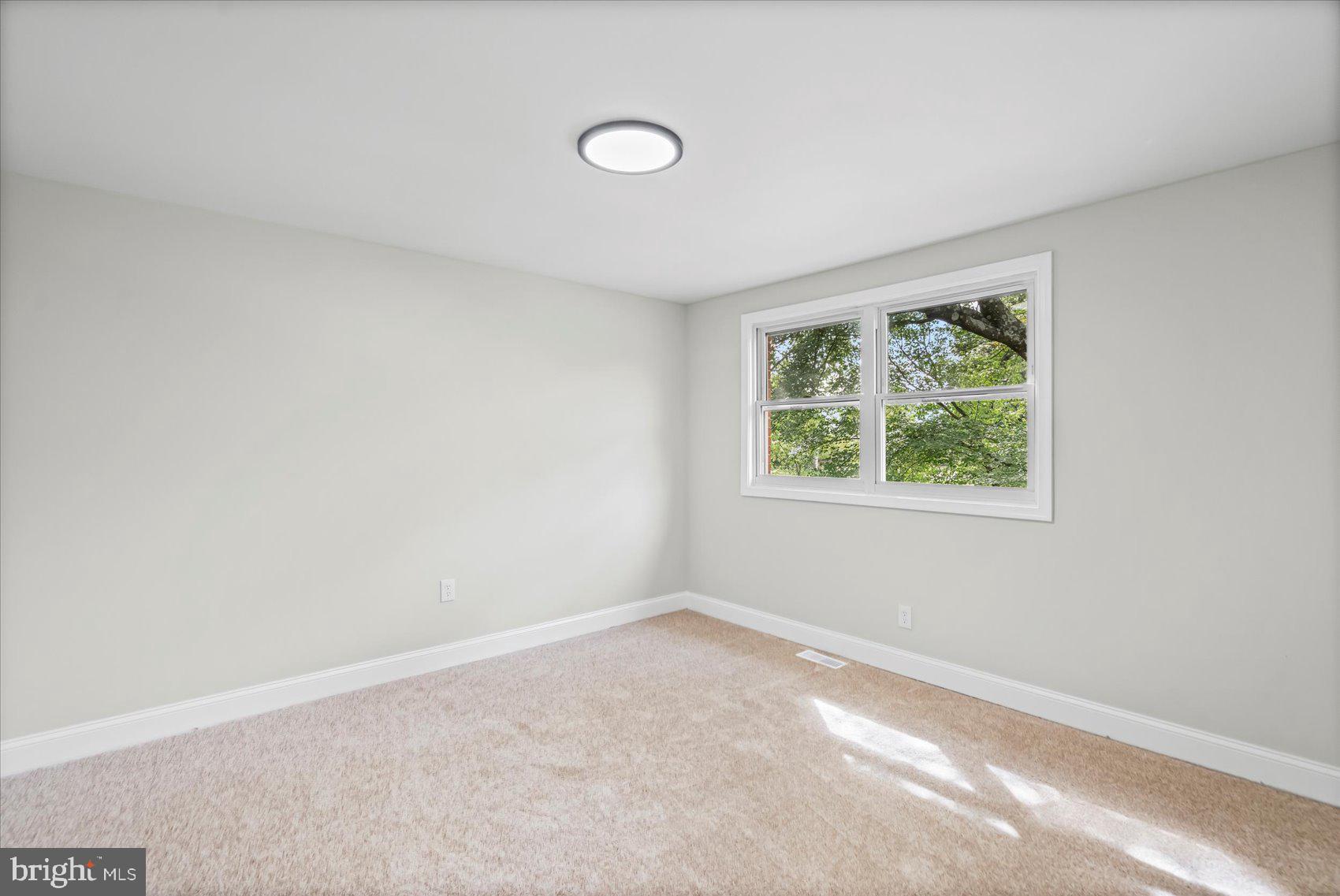 1812 Ingram Road Baltimore, MD 21239 - Photo 22 of 45 an empty room with a window