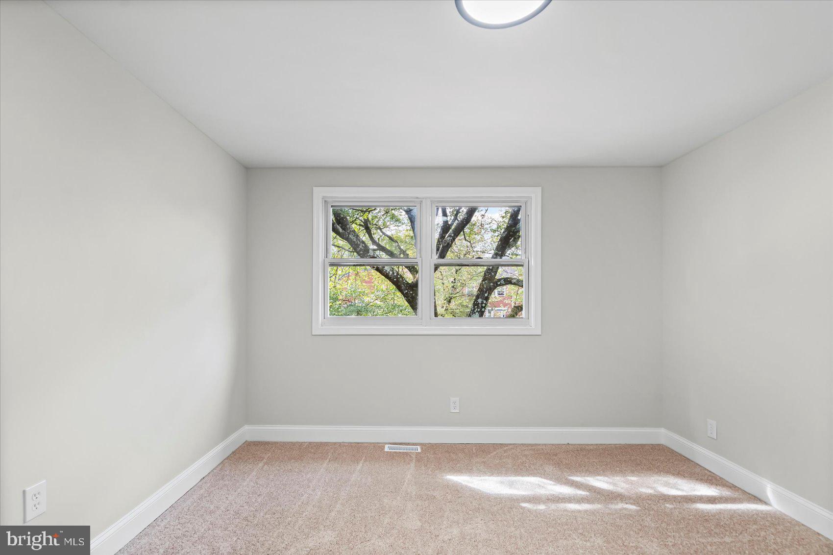 1812 Ingram Road Baltimore, MD 21239 - Photo 23 of 45 an empty room with window