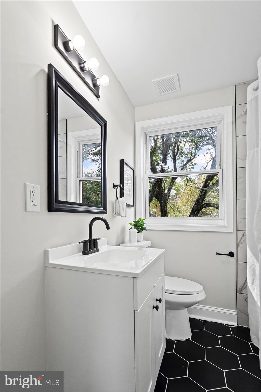 1812 Ingram Road Baltimore, MD 21239 - Photo 25 of 45 a bathroom with a sink and a mirror