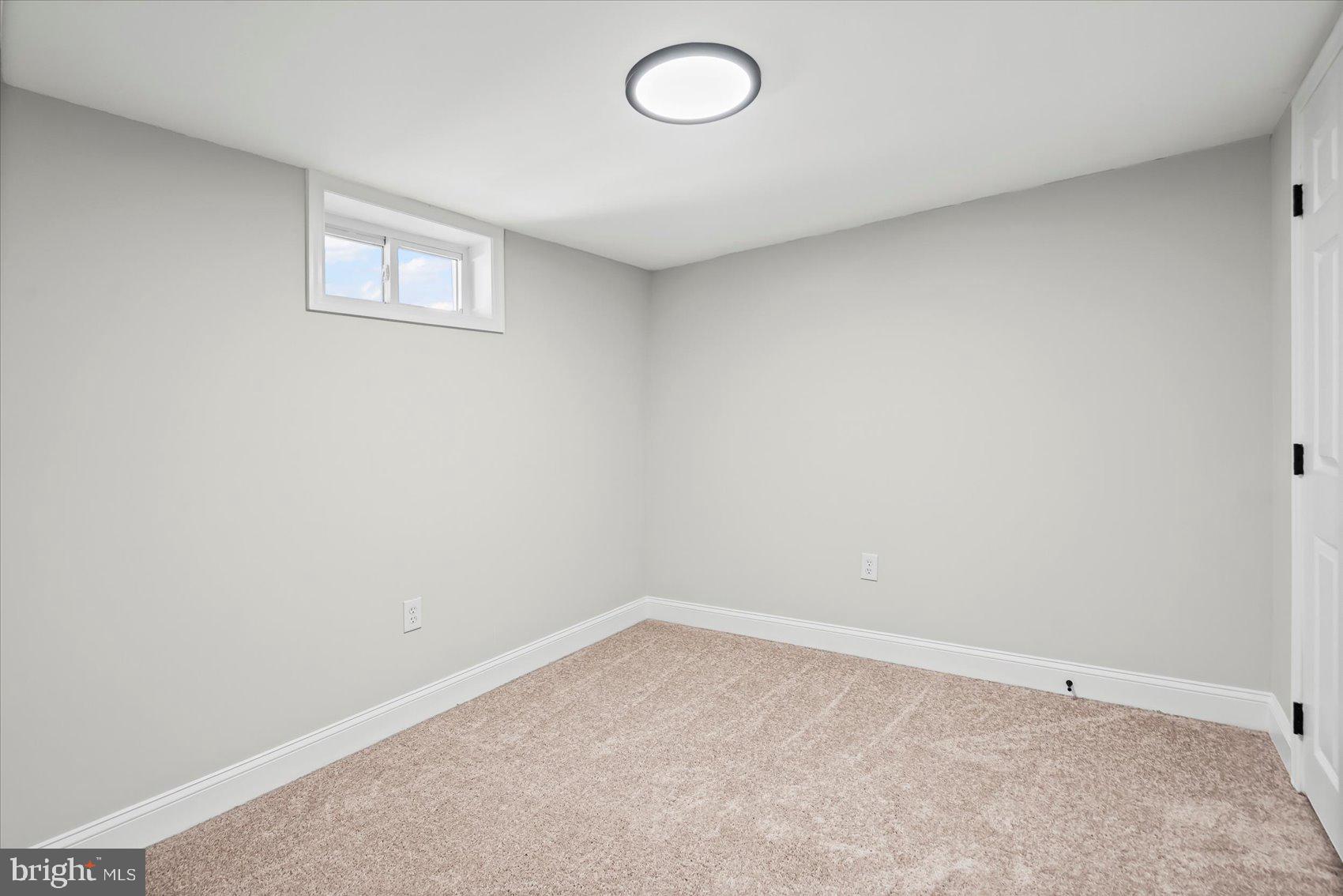 1812 Ingram Road Baltimore, MD 21239 - Photo 34 of 45 an empty room with a empty space and window