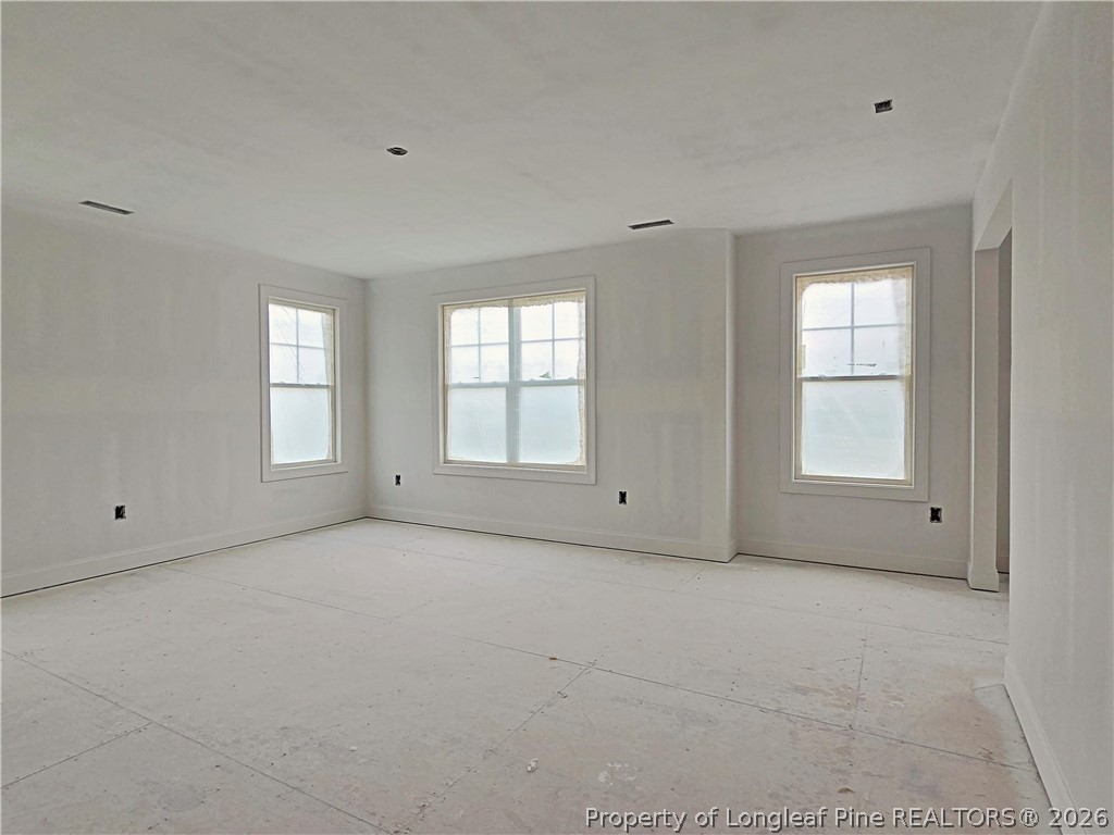 2650 Norrington Road Lillington, NC 27546 - Photo 16 of 24 a view of an empty room with windows