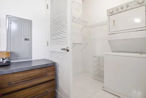 a bathroom with a shower and a sink