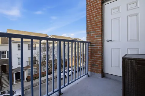 a view of a balcony with furniture