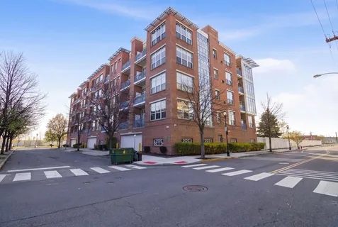 a view of a building with a street