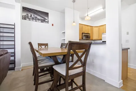 a view of a dining room with furniture
