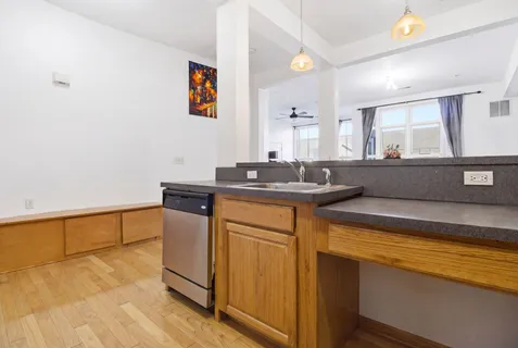 a kitchen with stainless steel appliances granite countertop a sink and cabinets