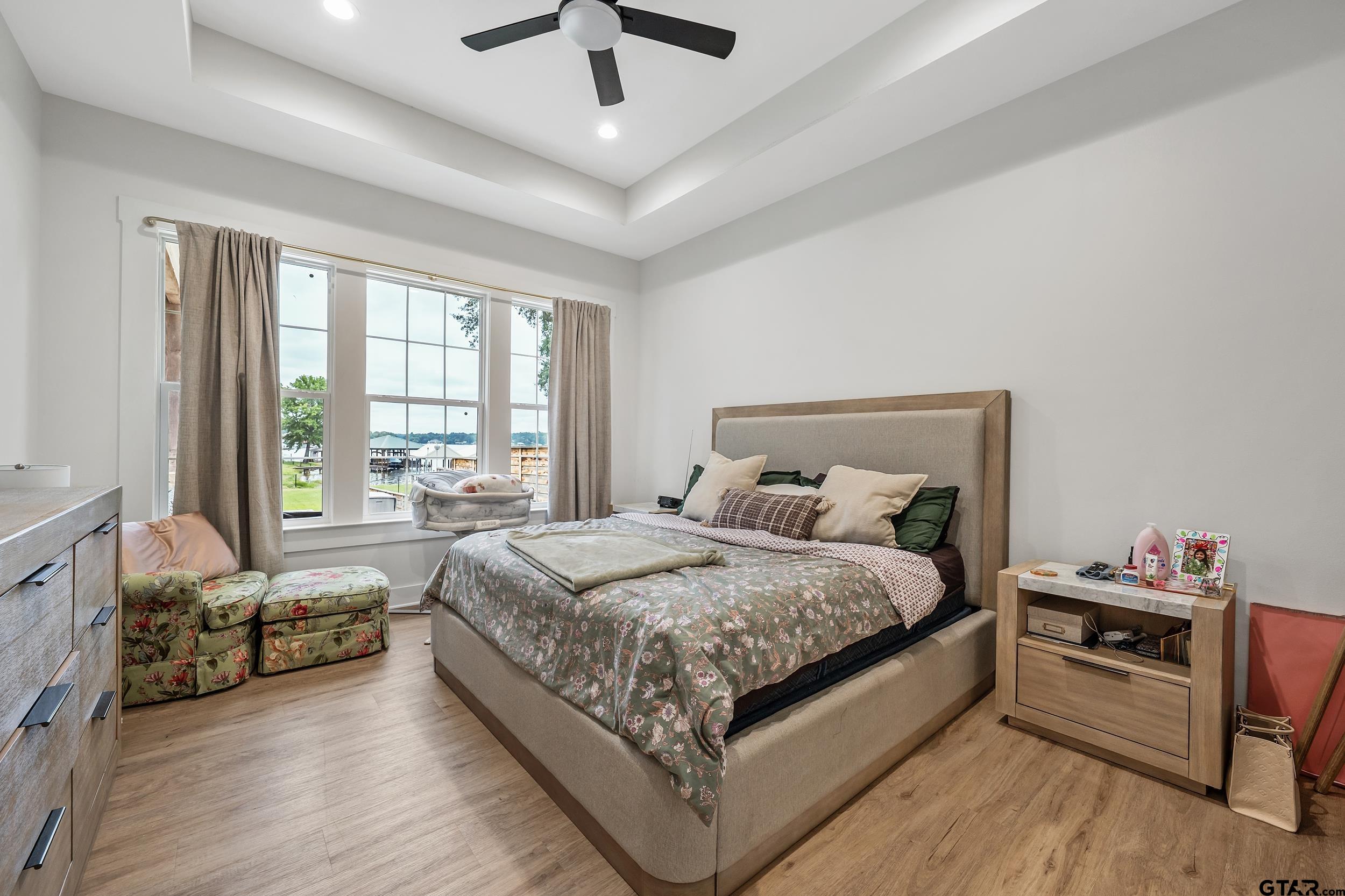 16837 Wilson Road Tyler, TX 75707 - Photo 20 of 44 a spacious bedroom with a bed and a couch