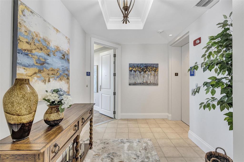 140 Riviera Dunes Way, Unit 206 Palmetto, FL 34221 - Photo 5 of 46 a living room with a potted plant