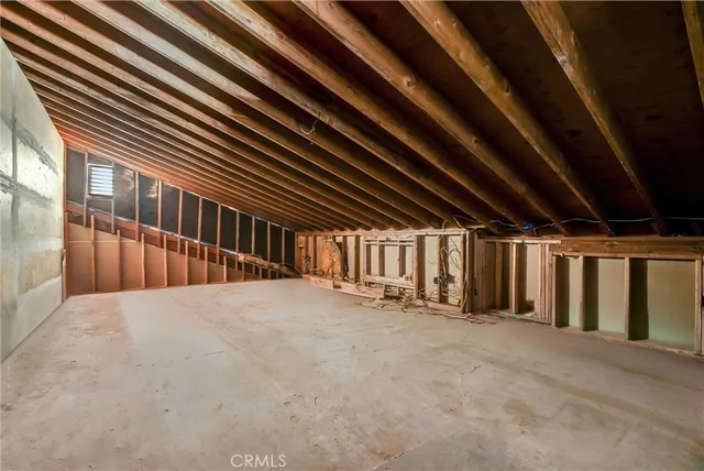 a view of a swimming pool with a patio and a yard