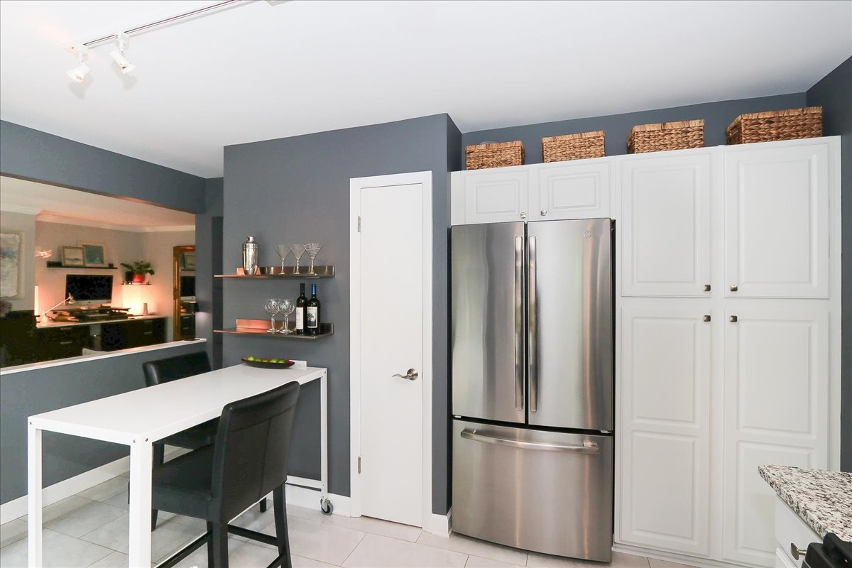 129 Regency Drive Lombard, IL 60148 - Photo 17 of 58 a kitchen with stainless steel appliances a refrigerator and cabinets