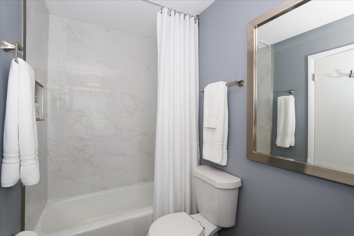129 Regency Drive Lombard, IL 60148 - Photo 30 of 58 a bathroom with a granite countertop shower a toilet and sink