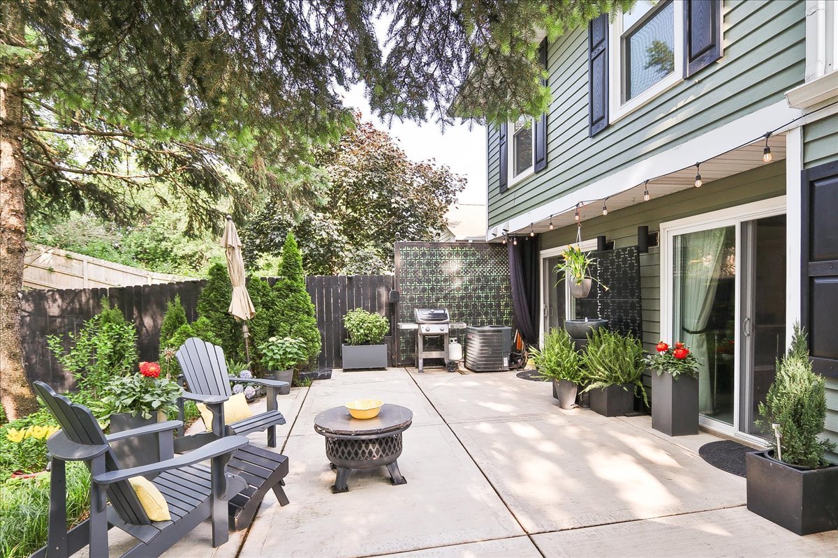 129 Regency Drive Lombard, IL 60148 - Photo 38 of 58 a view of a patio with chairs and potted plants