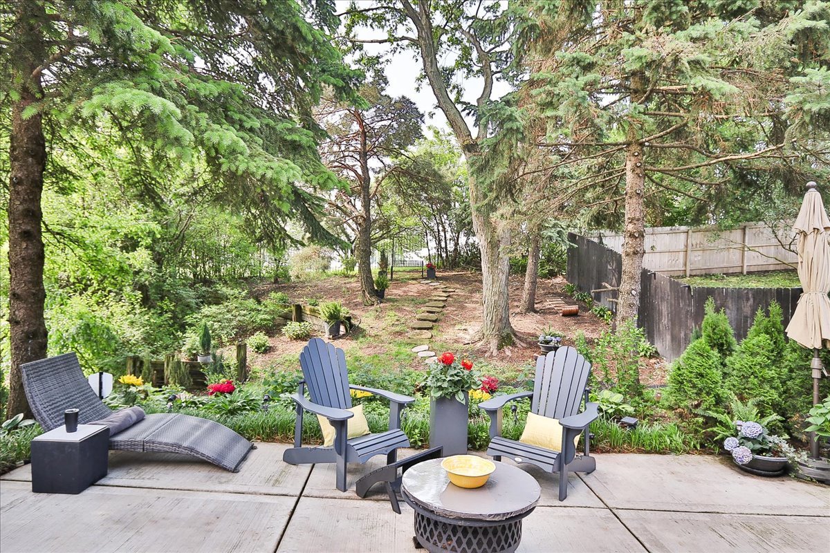 129 Regency Drive Lombard, IL 60148 - Photo 40 of 58 a view of a patio with furniture and flowers