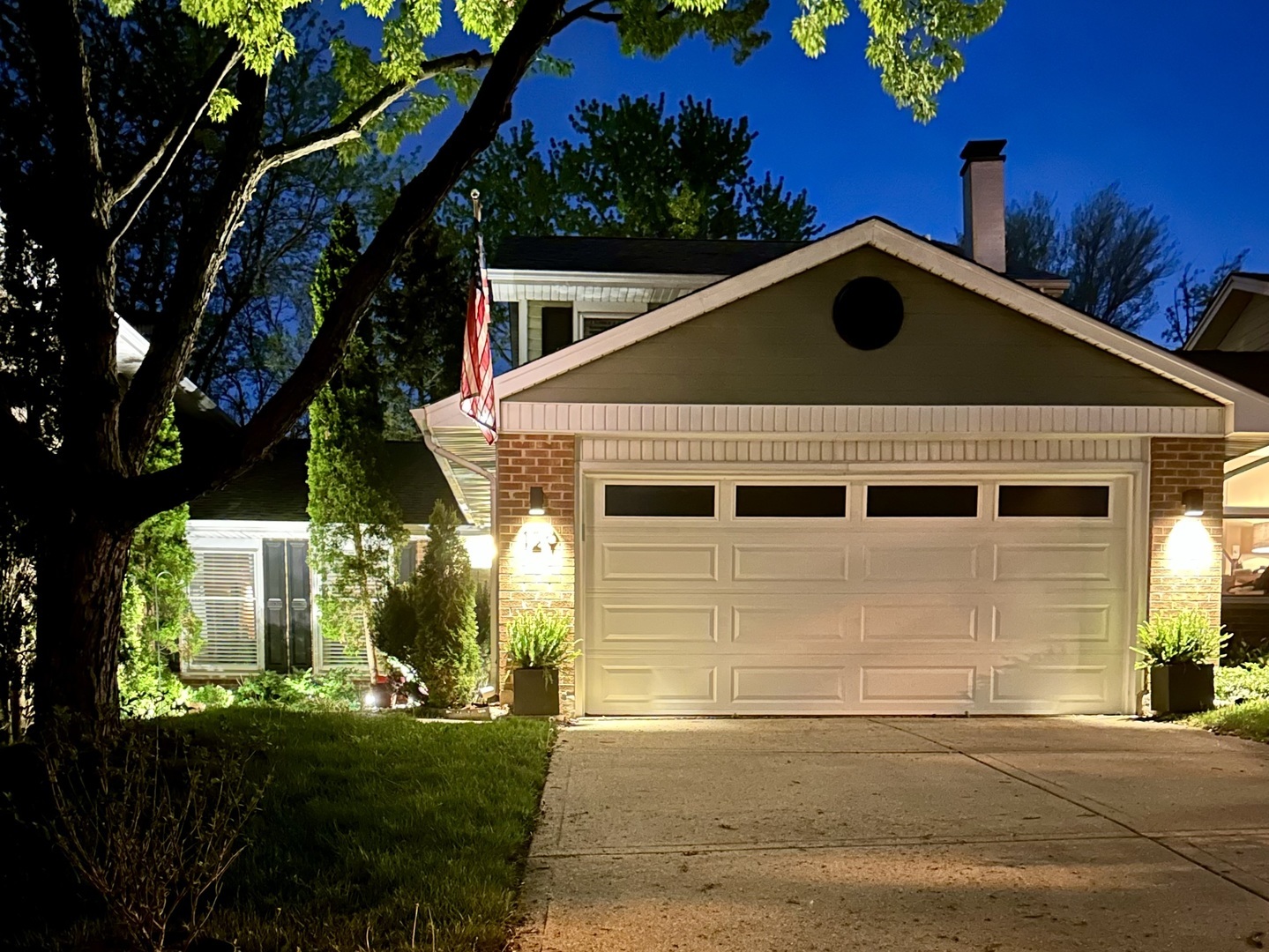 129 Regency Drive Lombard, IL 60148 - Photo 5 of 58 a front view of a house with a yard
