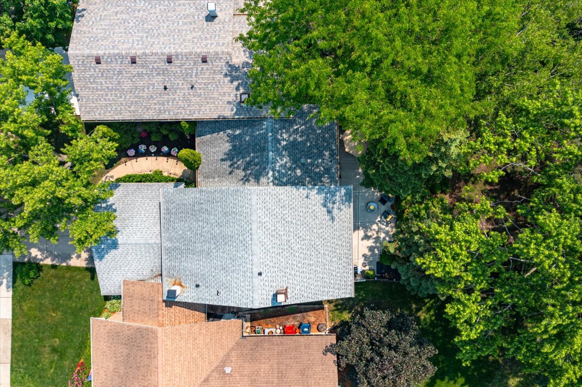 129 Regency Drive Lombard, IL 60148 - Photo 51 of 58 an aerial view of a house with yard and trees in the background