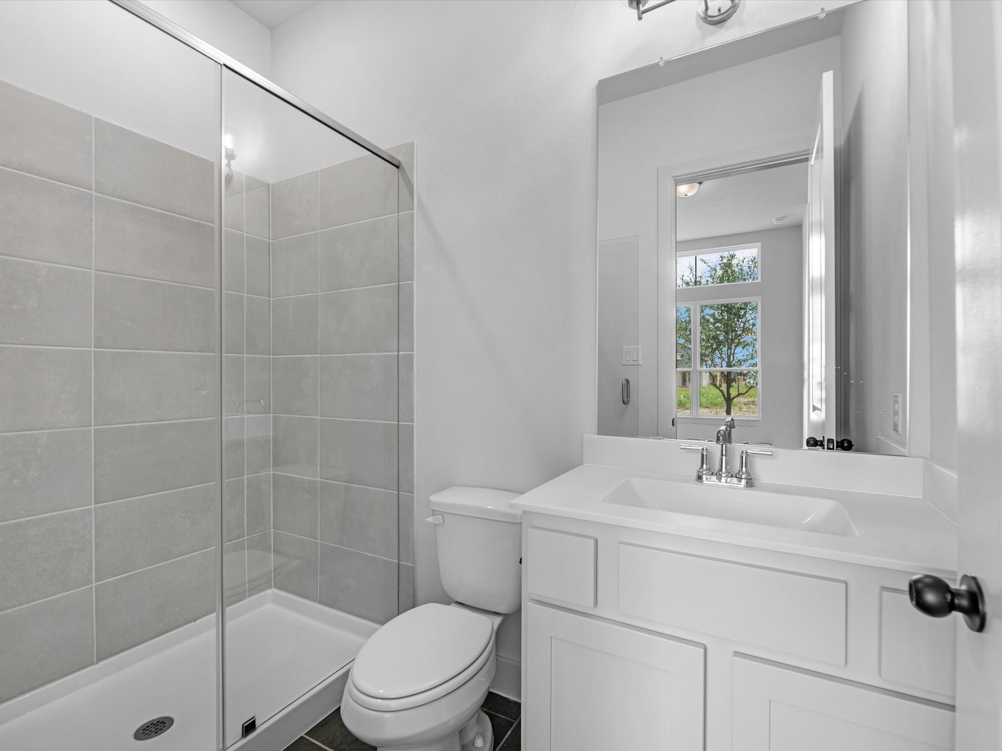 8915 Acropolis Lane Manvel, TX 77578 - Photo 17 of 32 a bathroom with a sink toilet and shower