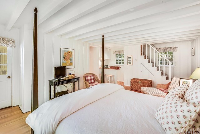 167 Cedar Circle Lake Arrowhead, CA 92352 - Photo 16 of 38 a bedroom with a bed and wooden floor