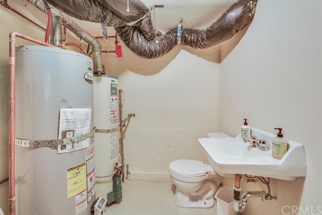 167 Cedar Circle Lake Arrowhead, CA 92352 - Photo 22 of 38 a bathroom with a sink mirror vanity and toilet