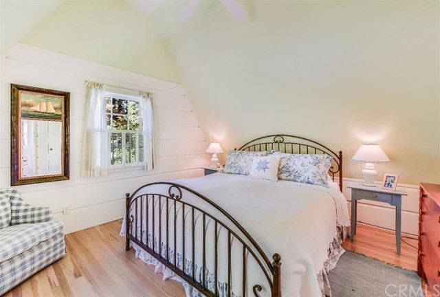 167 Cedar Circle Lake Arrowhead, CA 92352 - Photo 10 of 38 a bedroom with a bed and a window