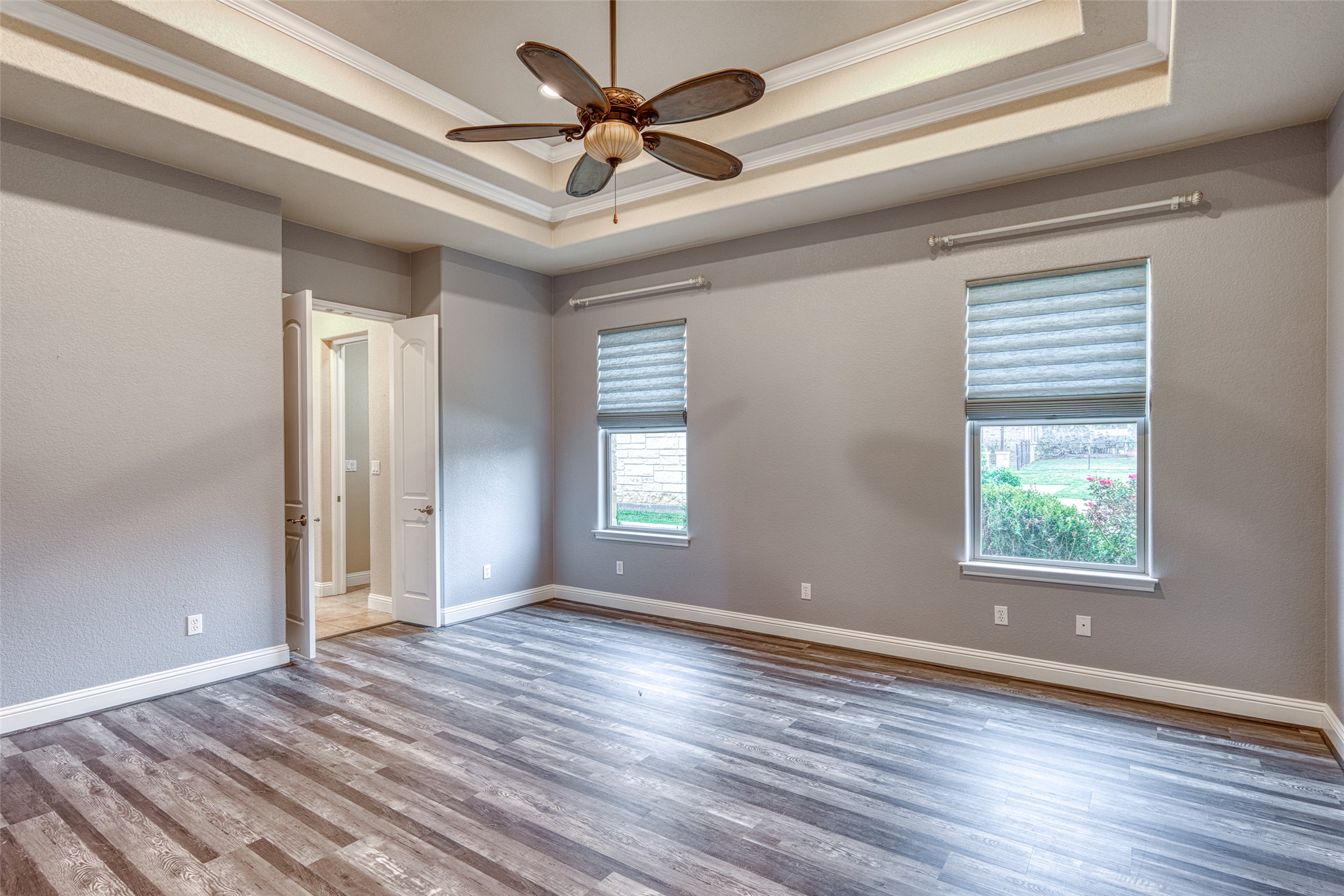 114 Preston Trail Meadowlakes, TX 78654 - Photo 11 of 23 a view of empty room with wooden floor and fan