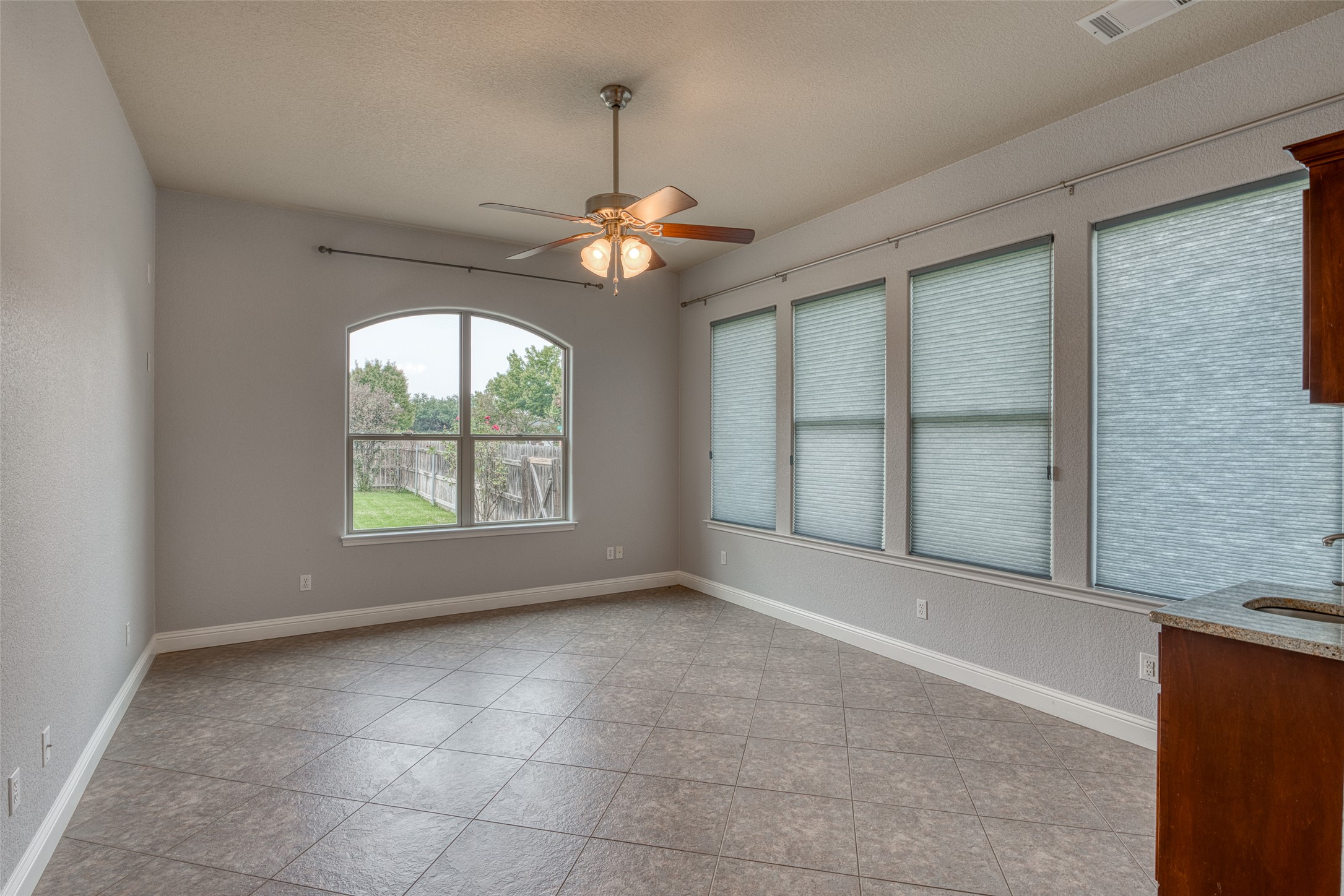 114 Preston Trail Meadowlakes, TX 78654 - Photo 9 of 23 a view of an empty room with chandelier fan and window