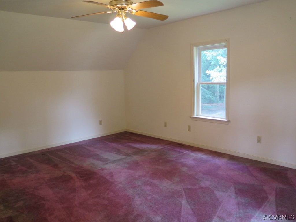7432 Trailing Rock Road Prince George, VA 23875 - Photo 16 of 24 an empty room with windows and fan