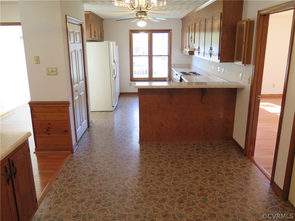 7432 Trailing Rock Road Prince George, VA 23875 - Photo 7 of 24 wooden floor in an empty room with a window