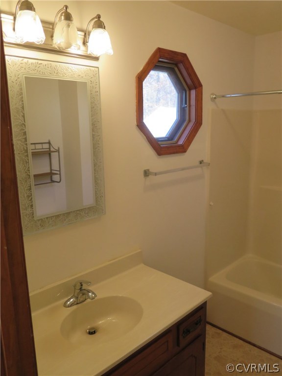 7432 Trailing Rock Road Prince George, VA 23875 - Photo 10 of 24 a bathroom with a sink and a mirror