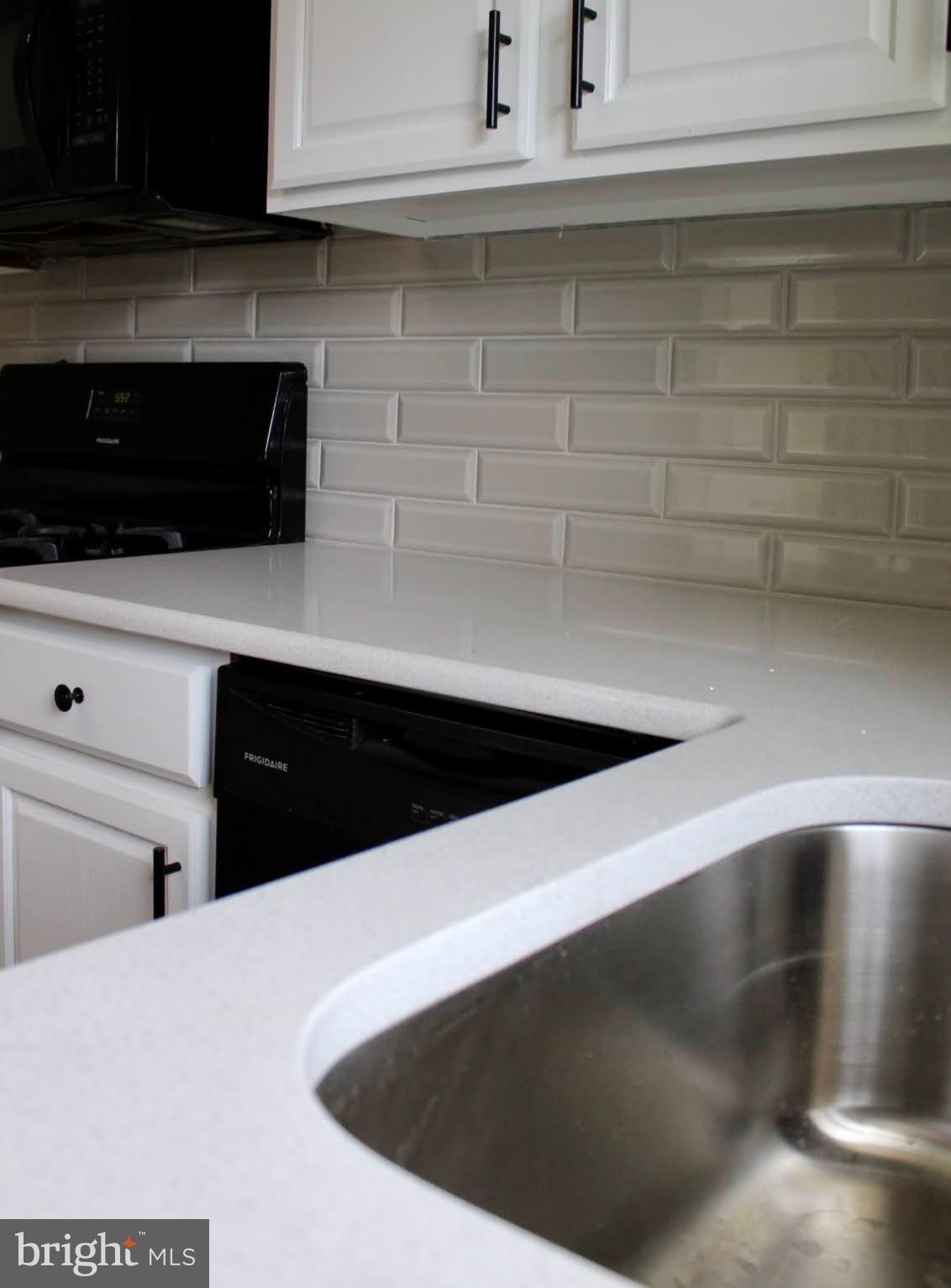 608 Whitman Street Glassboro, NJ 08028 - Photo 5 of 8 a kitchen with a refrigerator and a stove