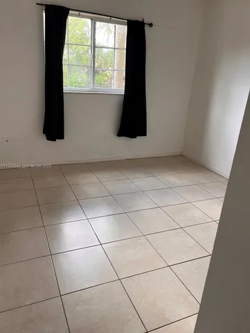 a view of wooden floor and utility room in a room