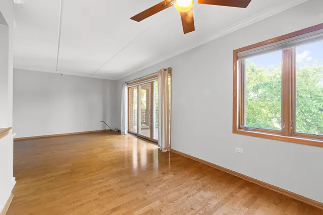 a view of a kitchen with a sink stove cabinets and empty room