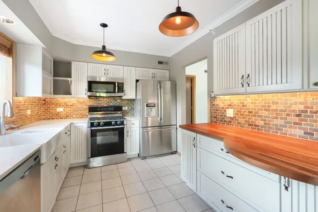 a kitchen with a sink and a stove